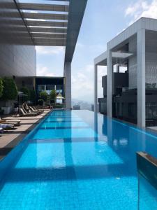 a swimming pool on the roof of a building at Pool View Platinum KLCC in Kuala Lumpur