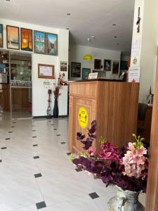 a shop with a podium and flowers on the floor at Hotel Margarita in Kranevo