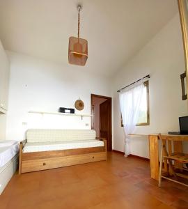 Ένα ή περισσότερα κρεβάτια σε δωμάτιο στο Casa Fadda