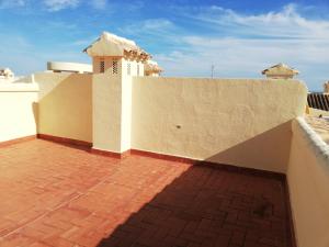 a balcony of a house with a brick floor at Residencial Les Motes Solo Familias in Xeraco