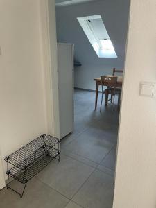 a kitchen and dining room with a table and a refrigerator at Joanna Apartment - MA City 2 in Mannheim