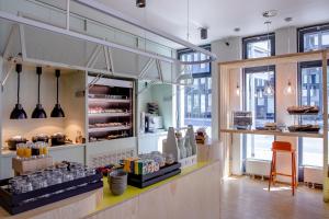 a bakery with a counter with food on it at LyvInn Hotel Frankfurt Messe in Frankfurt