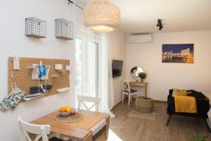 a living room with a table and a dining room at Studio and hot tub in Split