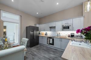 Kuchyň nebo kuchyňský kout v ubytování Finest Retreats - Peace Retreats Apartment, Pwllheli