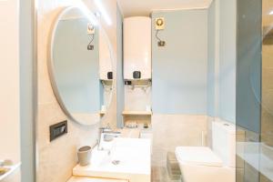 a bathroom with a sink and a mirror at 178 - Baia delle Favole Loft, 300metri dal mare di Sestri in Sestri Levante