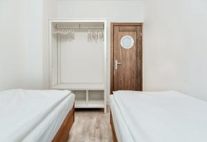 מיטה או מיטות בחדר ב-Sea Apartment Gdynia