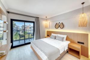 Postel nebo postele na pokoji v ubytování Hildegard Hotel