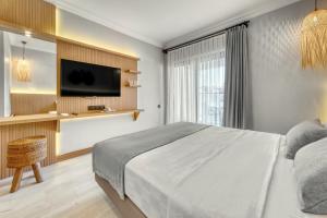 Postel nebo postele na pokoji v ubytování Hildegard Hotel