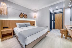 Postel nebo postele na pokoji v ubytování Hildegard Hotel