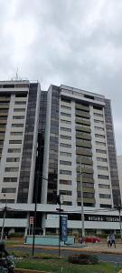 a large building with people walking in front of it at Apartment in Quito (La Carolina) in Quito