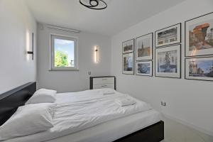 Posteľ alebo postele v izbe v ubytovaní Dom & House - Apartamenty Sunrise