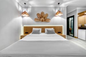 Postel nebo postele na pokoji v ubytování Hildegard Hotel