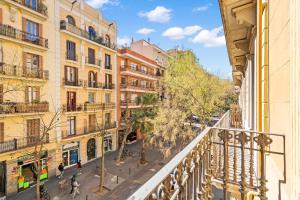 an apartment balcony in a city with buildings at AB Vila i Vila Apartments in Barcelona