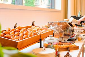 a buffet with two trays of pastries on a table at Hotel Gran Ultonia in Girona +58 photos