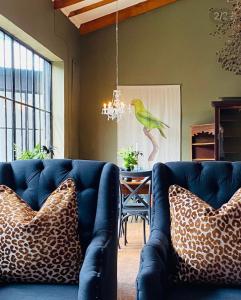 a living room with a blue couch and a table at The Hanover Luxury Hotel in Hanover