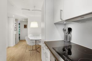 a kitchen with a counter top and a table at City Center Apartments 739 in Copenhagen