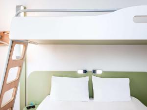 Ein Bett oder Betten in einem Zimmer der Unterkunft Ibis budget Wien Sankt Marx