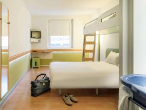 Ein Bett oder Betten in einem Zimmer der Unterkunft Ibis budget Wien Sankt Marx