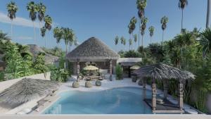 a resort with a swimming pool and a resort with palm trees at Karma Resort in Bophut