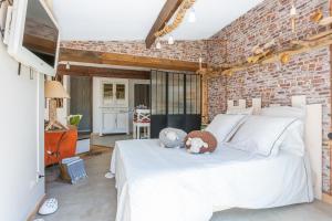 Ένα ή περισσότερα κρεβάτια σε δωμάτιο στο Lodge Berik - Loft pour 2 avec piscine