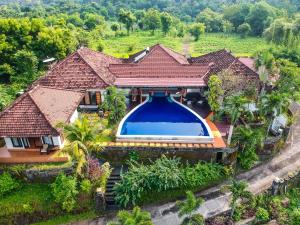 an aerial view of a house with a swimming pool at The Dharma Araminth Villa - Lovina Mountain and Sea View in Lovina