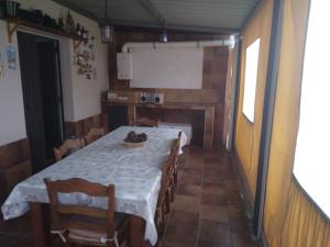 a dining room with a table and chairs in a room at Almajar 4 in El Puerto de Santa María