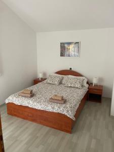 Postel nebo postele na pokoji v ubytování Apartmani Leskovar