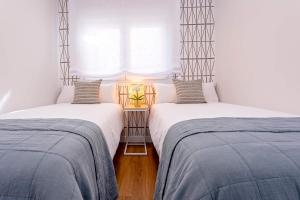 Posteľ alebo postele v izbe v ubytovaní Genteel Home Larios