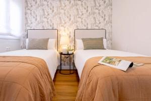 Posteľ alebo postele v izbe v ubytovaní Genteel Home Larios