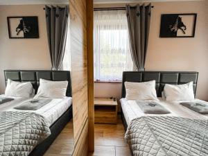 Posteľ alebo postele v izbe v ubytovaní VisitZakopane - Baron Apartment