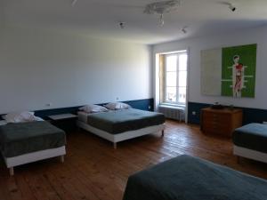Postel nebo postele na pokoji v ubytování Chambres d'Hôtes Les Pergolas