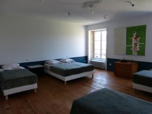 Ένα ή περισσότερα κρεβάτια σε δωμάτιο στο Chambres d'Hôtes Les Pergolas