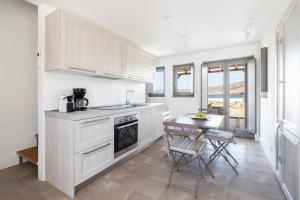 A cozinha ou cozinha compacta de Ammoa Beach Residences