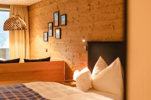 Postel nebo postele na pokoji v ubytování Boutiquehotel Grandau