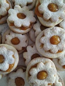 a pile of cookies covered in powdered sugar at B&B SA CROBE in Lanusei +15 photos