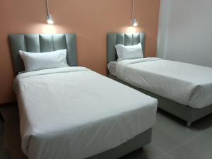 โรงแรม เดอะพีช / The Peach hotel客房内的一张或多张床位