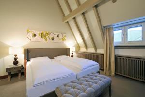 Postel nebo postele na pokoji v ubytování Hotel Ritter Durbach