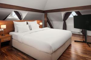 Łóżko lub łóżka w pokoju w obiekcie Harvey Spa Hotel
