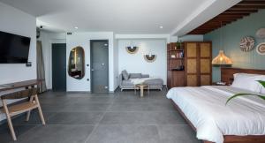 Voodi või voodid majutusasutuse Amyntas Seafront Hotel toas