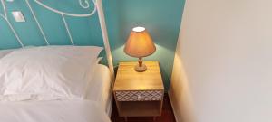 A bed or beds in a room at Sweet Maisonette in Corfu Town