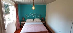 A bed or beds in a room at Sweet Maisonette in Corfu Town