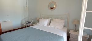 A bed or beds in a room at Sweet Maisonette in Corfu Town