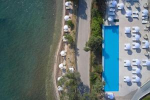 an overhead view of a row of tents next to the water at Kairaba Mythos Palace - Adults Only in Mesongi