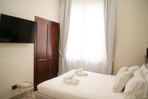 Postel nebo postele na pokoji v ubytování Monti 66 Hotel