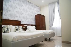 Postel nebo postele na pokoji v ubytování Monti 66 Hotel