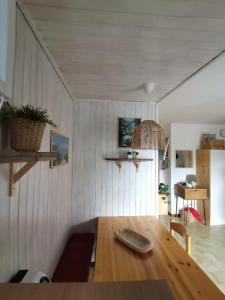 a dining room with a wooden table in a room at Soggiorno rilassante in montagna in Riolunato