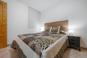 Postel nebo postele na pokoji v ubytování Hauzify I Apartament Pau Casals