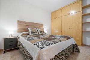 Postel nebo postele na pokoji v ubytování Hauzify I Apartament Pau Casals