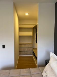 a bedroom with a closet with a bed at Terrazas de Godoy in Godoy Cruz