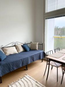 a room with a bed and a table and a window at TUUSULA Tuusula 15 min drive to Airport in Tuusula